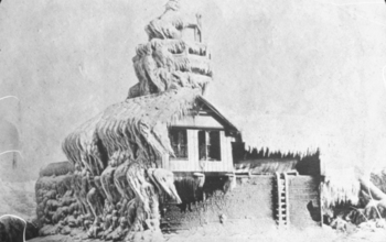 Historic photo of  a house covered in ice and snow following a snowstorm in Oswego, N.Y.;